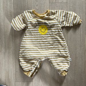Smiley face onesie.